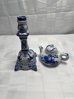 Candlestick and teapot front view