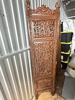 Full front view of carved hardwood panel