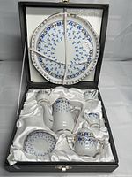 Entire tea set in satin-lined case showing all pieces and serving plate