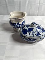 Creamer and lidded sugar bowl, side angle shows pattern and form