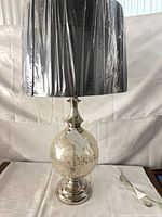 Front view of lamp with shade and base