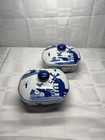 Both lidded boxes angled view showing windmill design