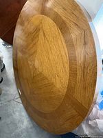 Top view of oak veneer round tabletop showing full surface and veneer pattern