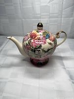 Left side view of teapot showing pattern, handle, spout