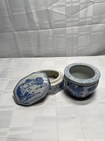 Round and octagonal blue-and-white porcelain trinket jars with lids facing forward