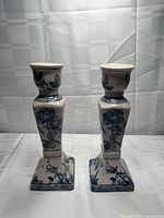 Front view of both ceramic candlestick holders