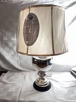 Full view of lamp with shade wrapped in plastic