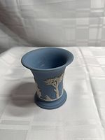 Front view showing flared rim and white relief trees