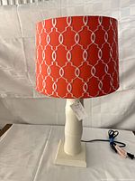 Full lamp with shade, cord visible