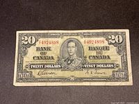 Obverse of 1937 $20 Bank of Canada note showing King George VI portrait and serial EE4924898