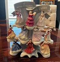 Full view of display stand with all nine figurines