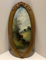 Full view of framed oval painting