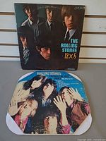 Front covers of both Rolling Stones LPs displayed together