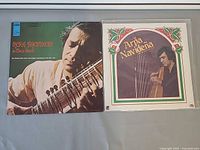 Front covers of Ravi Shankar and Arpa Navidena LPs in protective sleeves