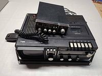 Top view showing TMK combo unit with Colt CB radio and microphone placed on top