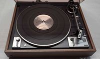 Top view of Dual 1249 turntable showing platter, tonearm, controls and dust cover