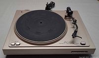 Top view of Marantz Model 6025 turntable with tonearm, platter, mat and controls visible