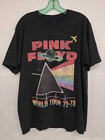 Front view of black Pink Floyd World Tour 72-73 graphic T-shirt showing full design