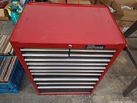 Front view of red and black Sears Craftsman steel tool cabinet showing drawer layout and overall condition