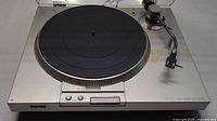 Top view of Sony PS-T15 turntable with platter, tonearm, and dust cover