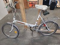 Full right-side view of Supercycle bicycle showing frame, wheels, rack, fenders, chain guard