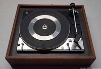 Top view of Dual 1214 turntable showing platter, tonearm, wood plinth