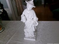 Full view of white porcelain statue