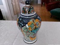 Full view of ginger jar with lid attached showing colorful pattern