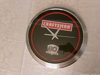 Front view showing Craftsman logo, red ring, bezel