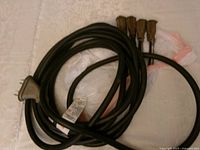 Coiled extension cord showing overall length and cable thickness