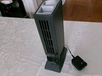 Full view of IonizAir air purifier with power adapter