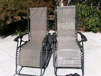 Front view of both folding anti-gravity chairs upright