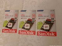 Front view showing three sealed SanDisk Ultra 16GB microSDHC cards