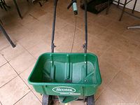 Front view of Scotts Speedy Green 3000 spreader showing hopper and handle