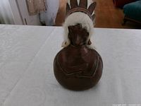 Front view of leather and horsehair decanter