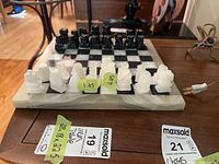 Top view of full stone chess set on board