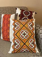 All three pillows displayed on couch