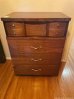 Front view of dresser showing all drawers and overall condition