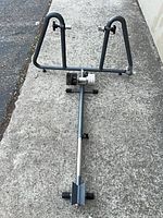overall view of bicycle trainer stand showing frame, resistance unit and extended support bar