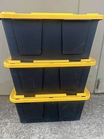 Stacked view of three totes showing overall condition