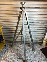 Full view of steel tripod stand extended