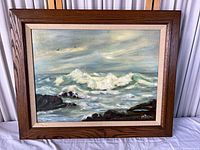 Frontal view of framed seascape painting