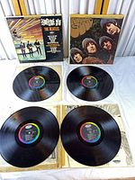 Overall lot with two jackets and four vinyl discs