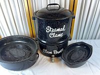 Front view of steamer pot with side pans