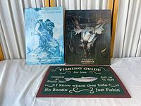 All three metal signs displayed together on table