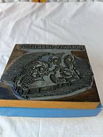 Full view of rubber stamp surface showing entire design and wood block