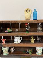 Shelf filled with assorted miniatures