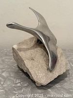 Front view of aluminum Canada goose sculpture on granite base