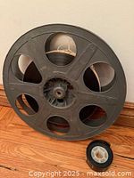Large 35 mm reel with film and loose small core