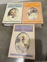 Front covers of the three matching Mark Twain books